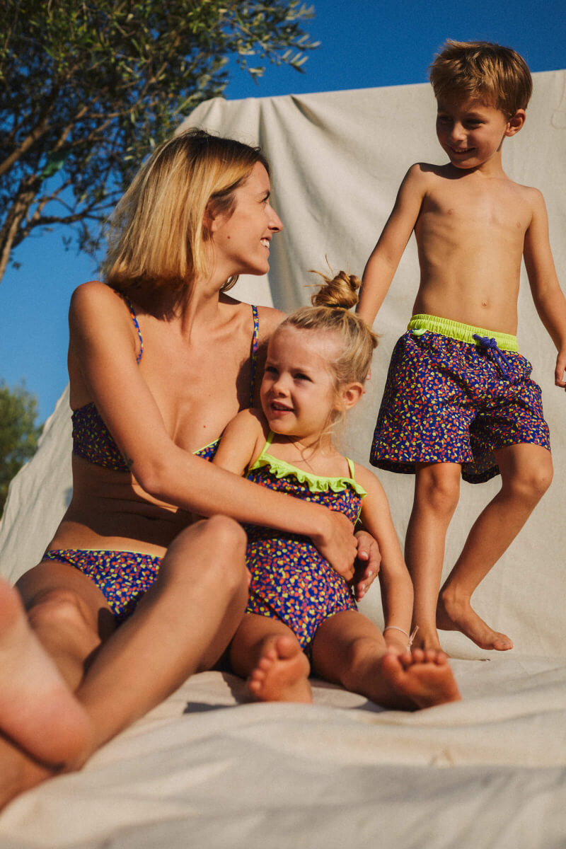 mother and daughter wearing matching swimsuits graffiti