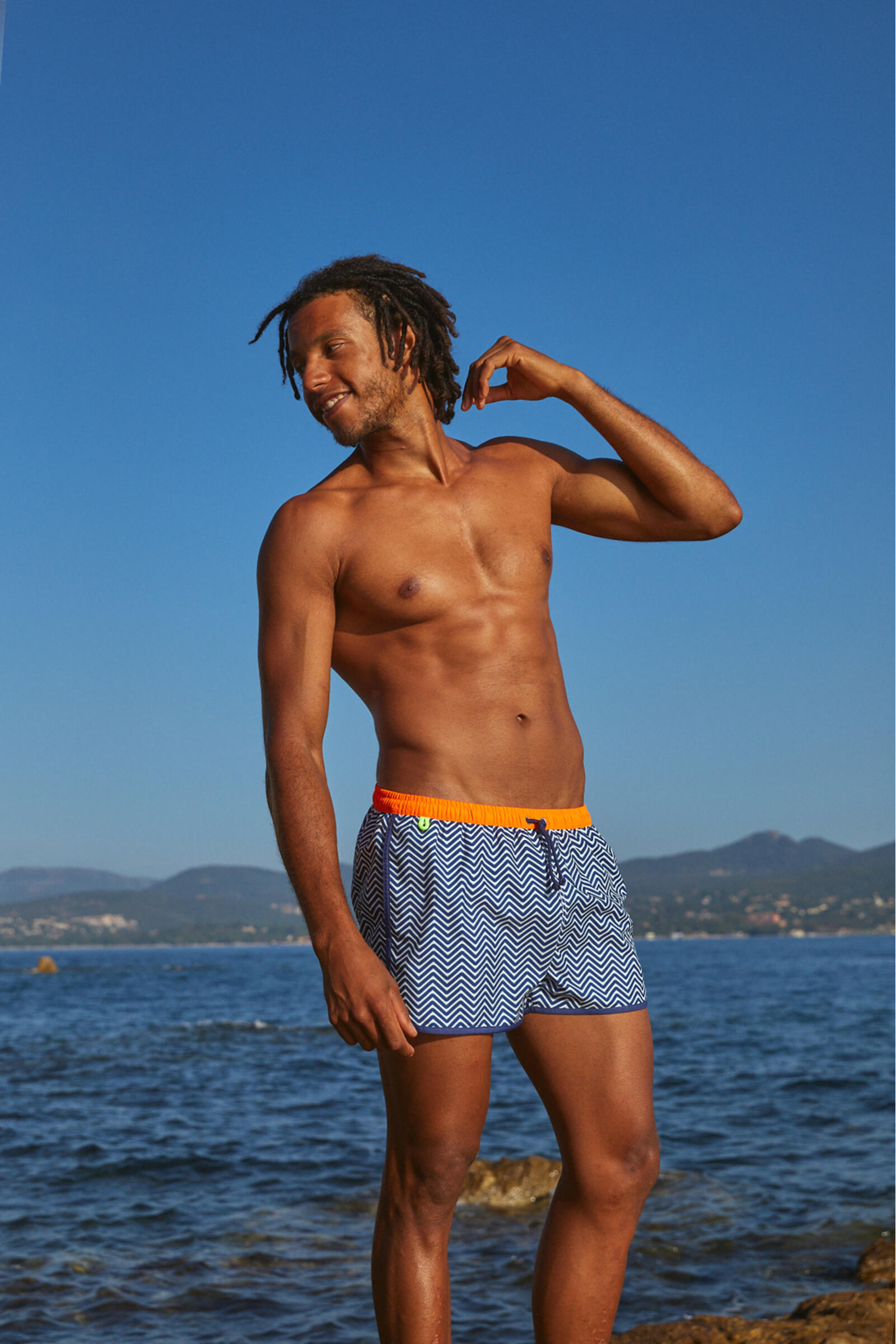Man wearing a short swimsuit Komodo Blue Olympe