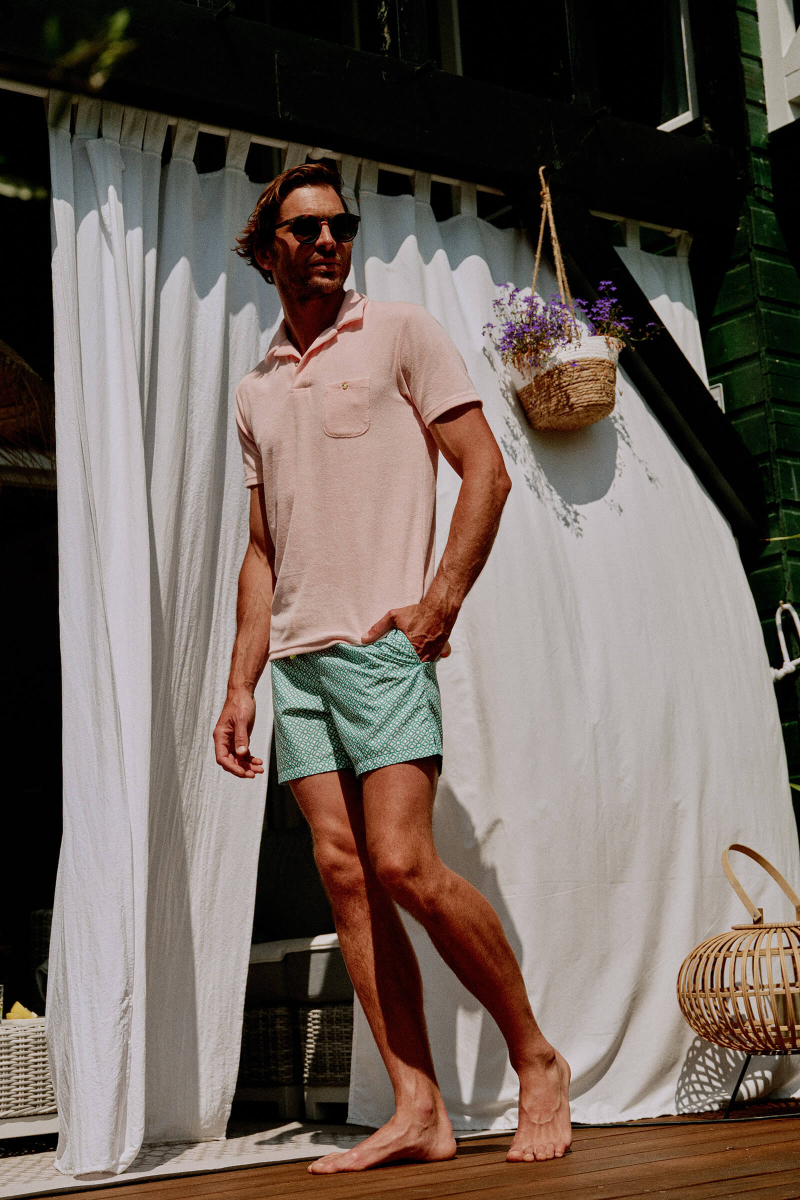 Man wearing a Light Pink terry cloth polo