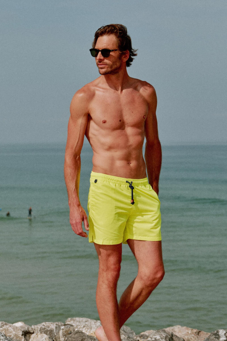 Man wearing a Screech swimsuit with elasticated belt Trawangan Yellow Neon