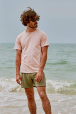 Man wearing a pink round neck t-shirt