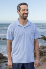 Man wearing a blue terry cloth polo